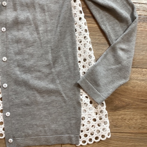 gray cardigan sweater with a white, eyelet-patterned fabric lining the back - Picture 4 of 6